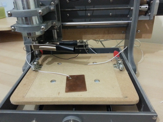 Picture of my CNC machine: Shows the touch-off plate, the ground clip and probe wire
